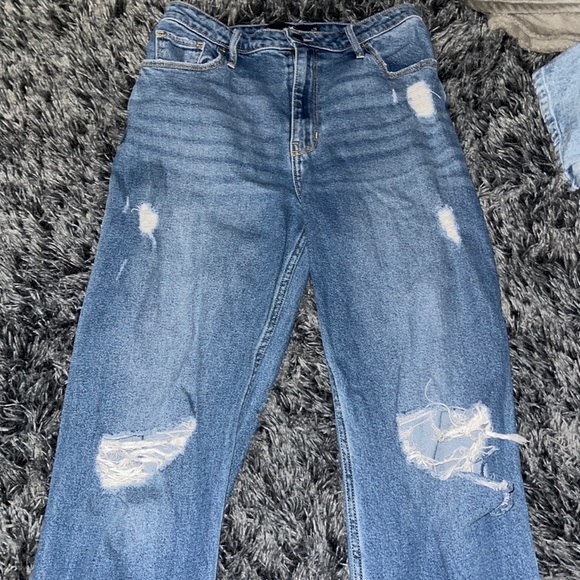 Hollister Denim - Worn many times. Still in great shape. One of the knee holes has a slight tear.